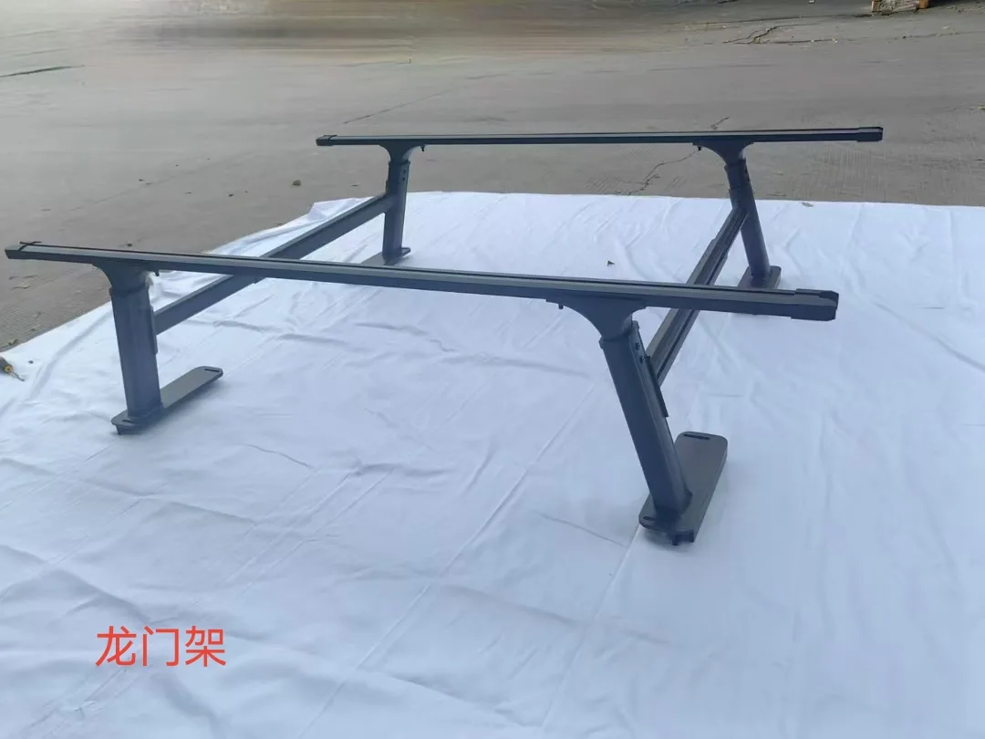 Black pickup-bed gantry frame displayed on a white surface